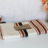 Striped fabric with a label on a white surface
